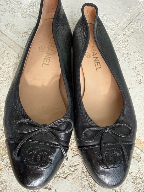 CHANEL Shoes - CHANEL Black Leather Cap-Toe Ballet Flats with Logo